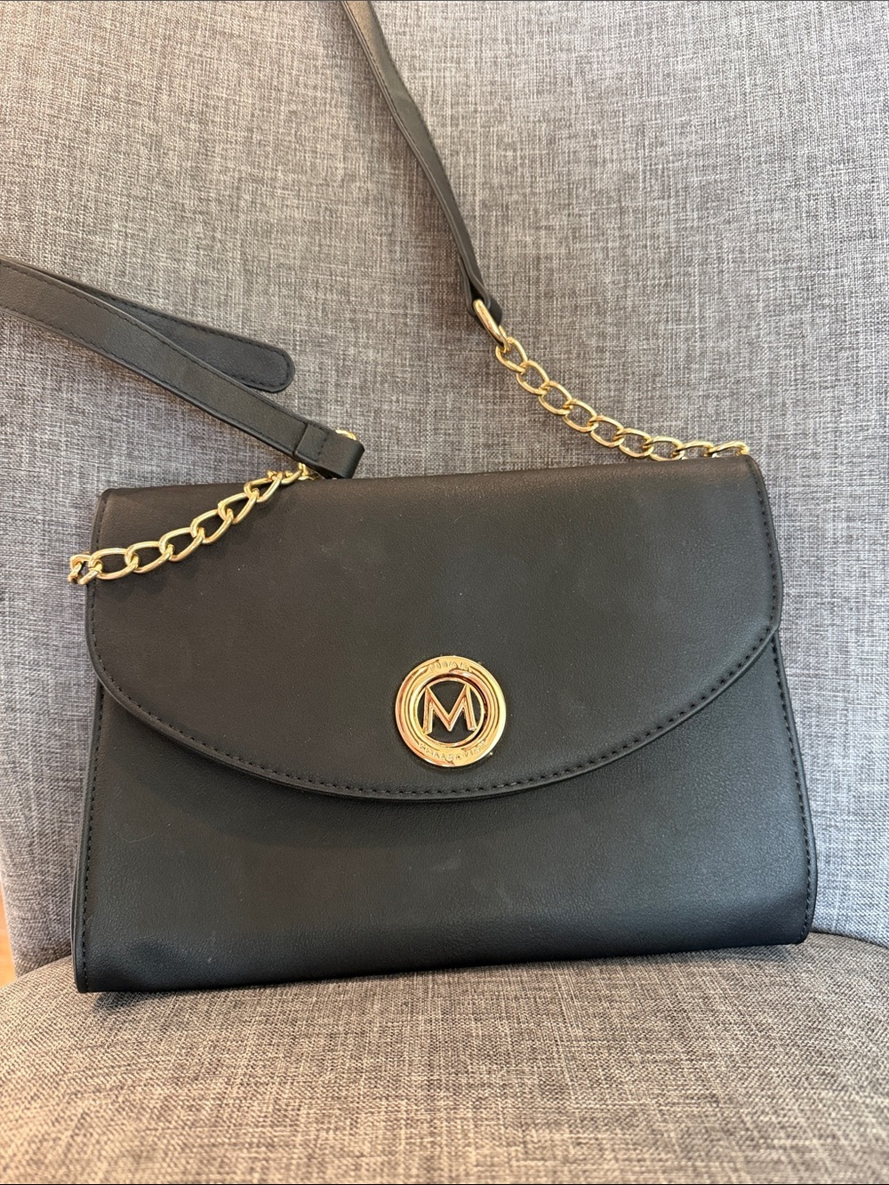Miak Collection Black Leather Crossbody Bag with Gold Chain Accent